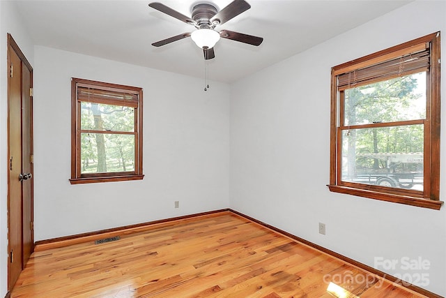 3311 Camden Rd, Marshville, NC 28103 - spare room featuring plenty of natural light, light wood-style floors, and ceiling fan