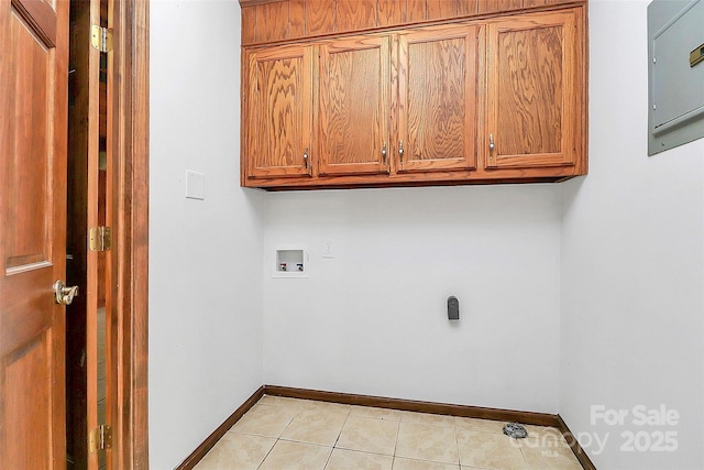 3311 Camden Rd, Marshville, NC 28103 - washroom featuring cabinet space, washer hookup, light tile patterned floors, and electric panel