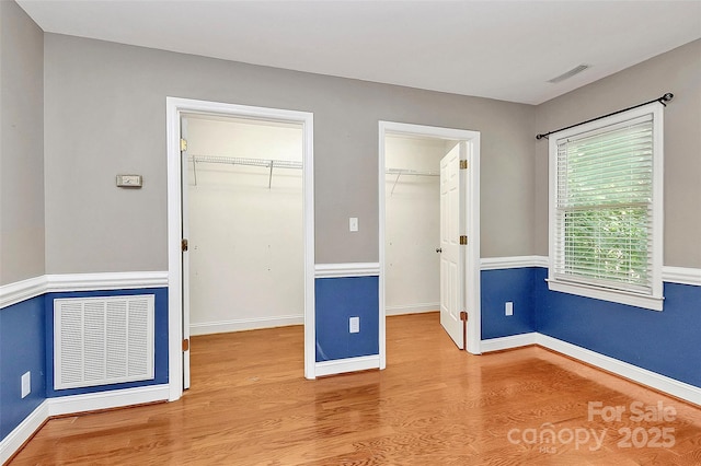 3311 Camden Rd, Marshville, NC 28103 - unfurnished bedroom featuring a spacious closet and wood finished floors