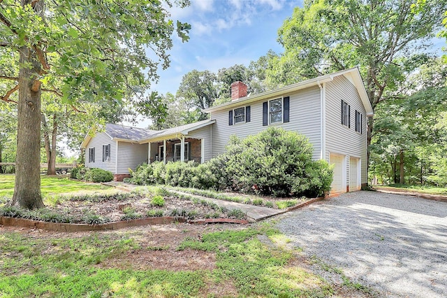 3311 Camden Rd, Marshville, NC 28103 - tri-level home featuring an attached garage, a chimney, and driveway