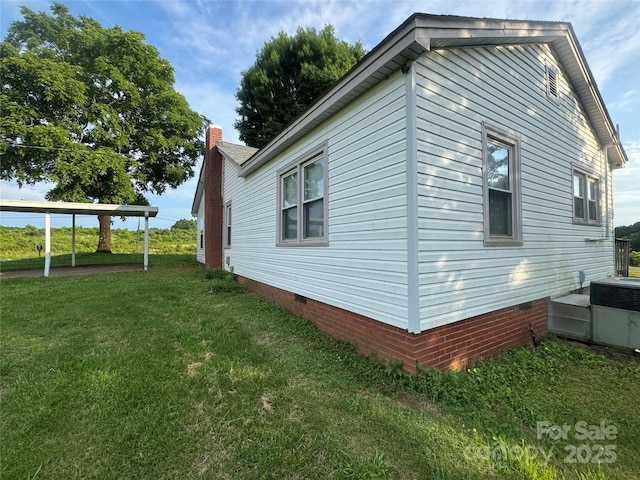 22987 Alonzo Rd, Oakboro, NC 28129 - view of side of home with crawl space, a lawn, and a chimney