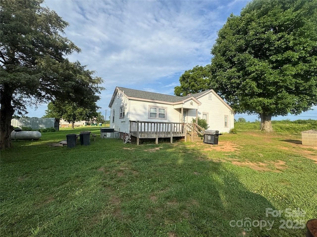 22987 Alonzo Rd, Oakboro, NC 28129 - rear view of property with a wooden deck and a lawn