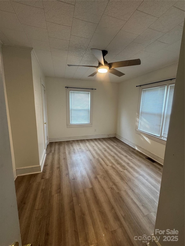22987 Alonzo Rd, Oakboro, NC 28129 - unfurnished room featuring a ceiling fan and wood finished floors