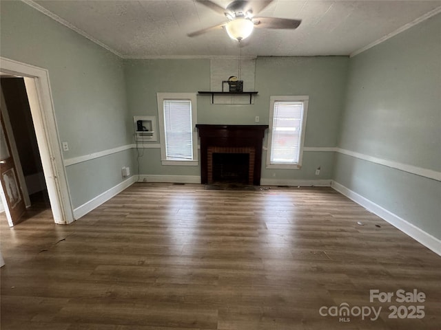 22987 Alonzo Rd, Oakboro, NC 28129 - unfurnished living room with ceiling fan, crown molding, a fireplace, and dark wood finished floors