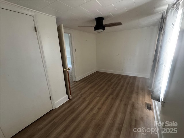22987 Alonzo Rd, Oakboro, NC 28129 - empty room featuring wood finished floors, a ceiling fan, and crown molding