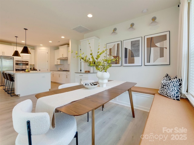 16108 Langston Dr, Charlotte, NC 28278 - dining space with light wood-style flooring and recessed lighting