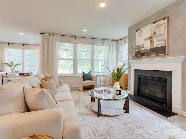 16108 Langston Dr, Charlotte, NC 28278 - living area with a fireplace with flush hearth, recessed lighting, and wood finished floors