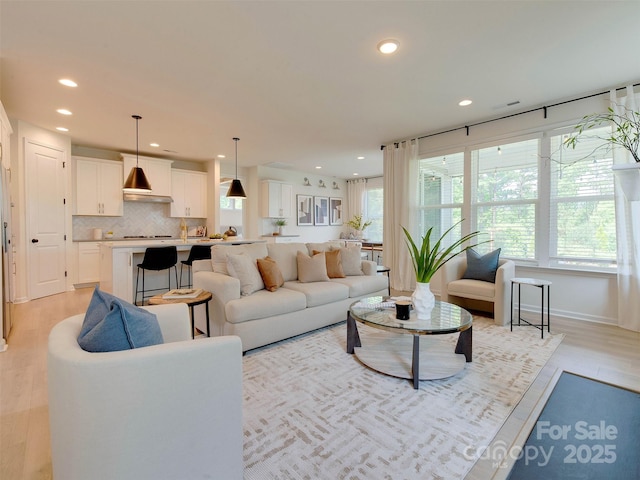 16108 Langston Dr, Charlotte, NC 28278 - living area with plenty of natural light, recessed lighting, and light wood finished floors