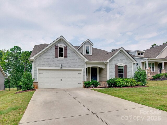 16108 Langston Dr, Charlotte, NC 28278 - craftsman inspired home featuring stone siding, a front yard, and driveway