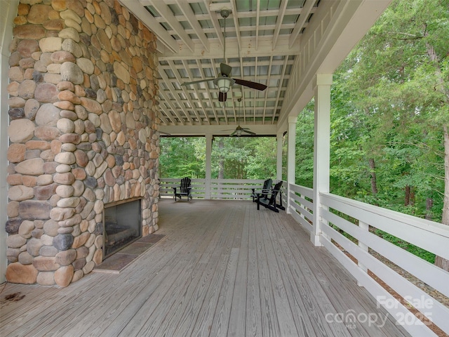 16108 Langston Dr, Charlotte, NC 28278 - deck featuring a ceiling fan and a fireplace