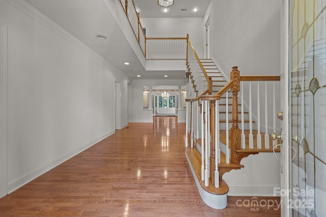 322 Oakview Dr, Salisbury, NC 28146 - foyer entrance featuring stairs, a chandelier, wood finished floors, recessed lighting, and ornamental molding