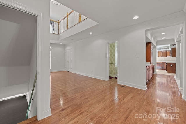 322 Oakview Dr, Salisbury, NC 28146 - unfurnished living room featuring light wood finished floors, crown molding, and recessed lighting