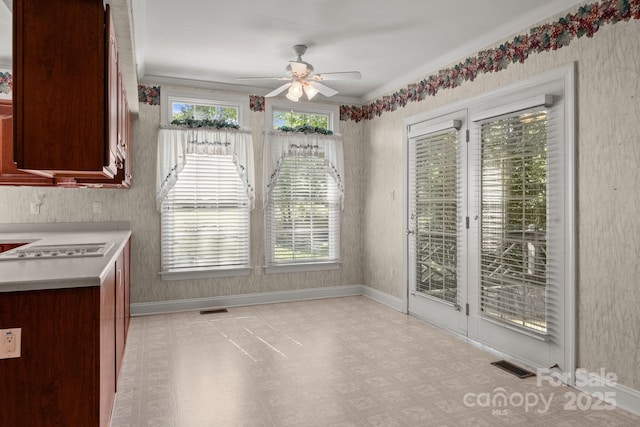 322 Oakview Dr, Salisbury, NC 28146 - unfurnished dining area with a ceiling fan, light flooring, and crown molding