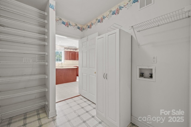 322 Oakview Dr, Salisbury, NC 28146 - laundry area featuring washer hookup and light flooring
