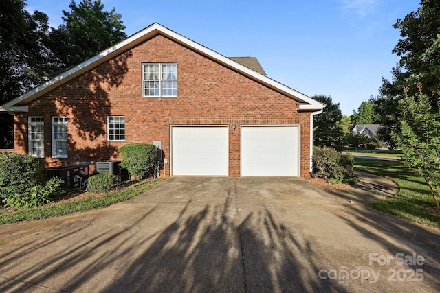 322 Oakview Dr, Salisbury, NC 28146 - view of home's exterior with concrete driveway, brick siding, and a garage