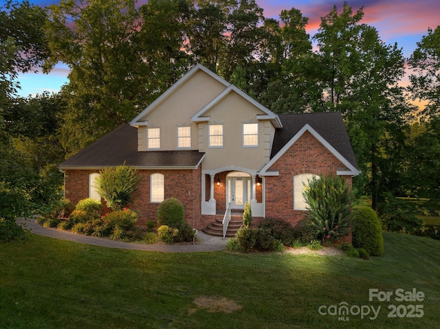 322 Oakview Dr, Salisbury, NC 28146 - traditional-style home with brick siding, a yard, and roof with shingles