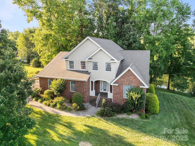 322 Oakview Dr, Salisbury, NC 28146 - traditional home featuring brick siding, roof with shingles, and a front lawn