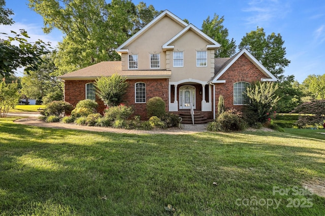 322 Oakview Dr, Salisbury, NC 28146 - traditional home with brick siding, a front lawn, and stucco siding