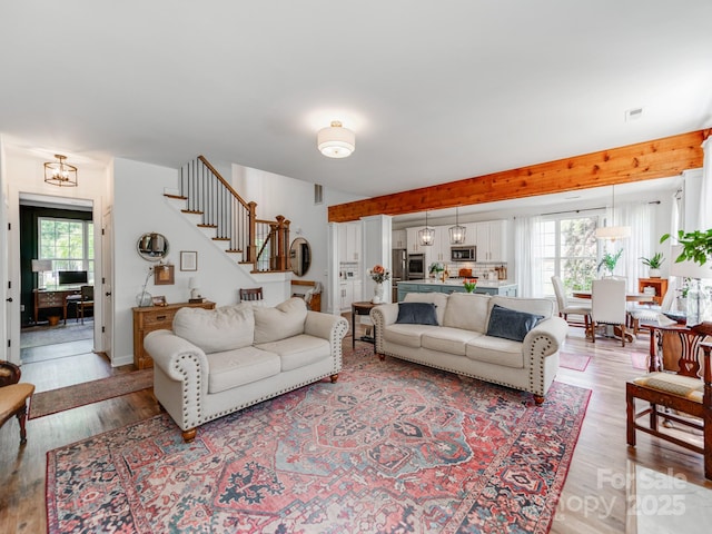 1605 Ambergate Dr, Waxhaw, NC 28173 - living area with stairs and light wood-style floors