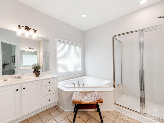 1605 Ambergate Dr, Waxhaw, NC 28173 - full bathroom with vanity, a shower stall, a garden tub, tile patterned floors, and recessed lighting