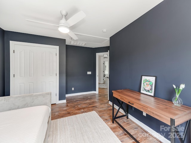 1605 Ambergate Dr, Waxhaw, NC 28173 - bedroom featuring wood finished floors, attic access, a closet, and a ceiling fan