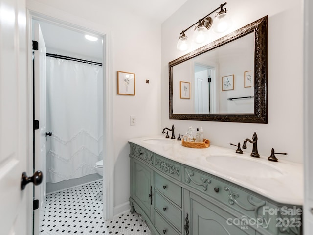 1605 Ambergate Dr, Waxhaw, NC 28173 - bathroom featuring double vanity and a shower with curtain