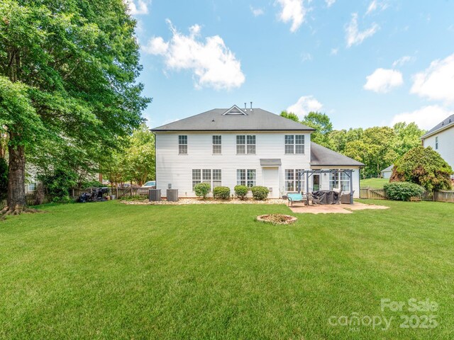 1605 Ambergate Dr, Waxhaw, NC 28173 - back of property featuring a patio area and a fenced backyard
