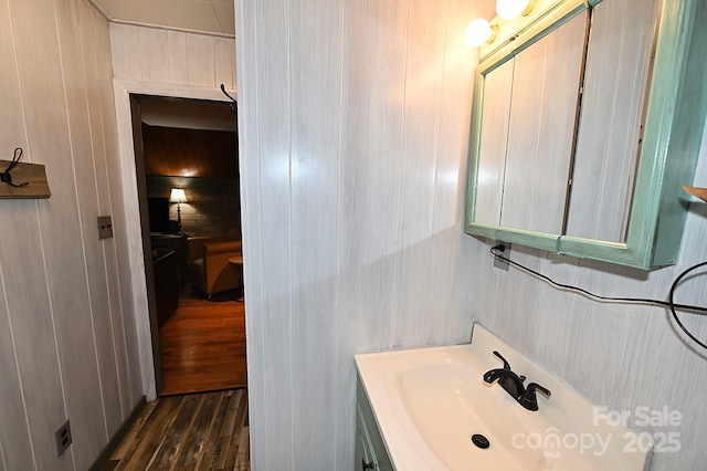 3430 Rose Creek Rd, Morganton, NC 28655 - bathroom with wooden walls, wood finished floors, and vanity