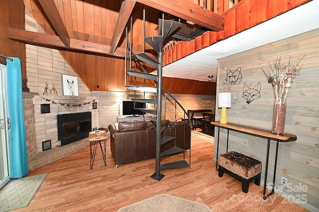 3430 Rose Creek Rd, Morganton, NC 28655 - living area with wooden walls, light wood-style flooring, a brick fireplace, and wooden ceiling