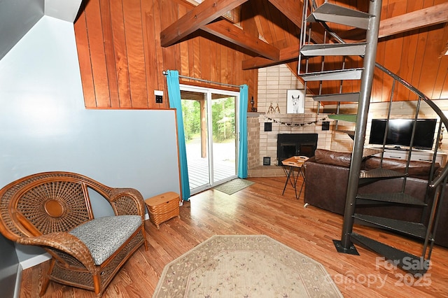 3430 Rose Creek Rd, Morganton, NC 28655 - living room with wood finished floors, wood walls, and a brick fireplace