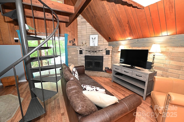 3430 Rose Creek Rd, Morganton, NC 28655 - living area with wooden walls, wood finished floors, lofted ceiling, and a brick fireplace