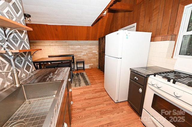 3430 Rose Creek Rd, Morganton, NC 28655 - kitchen featuring white appliances, wood walls, light wood-type flooring, and open shelves