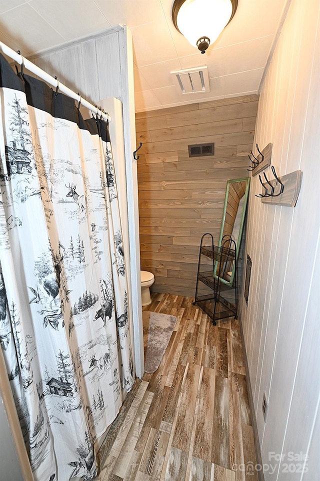 3430 Rose Creek Rd, Morganton, NC 28655 - full bath featuring wooden walls, wood finished floors, and a shower with curtain