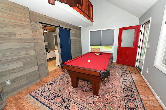 3430 Rose Creek Rd, Morganton, NC 28655 - game room with a barn door, light wood-style flooring, wood walls, vaulted ceiling, and pool table