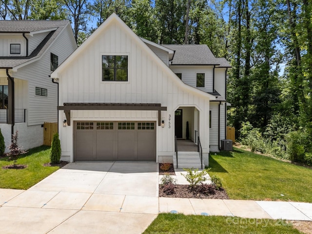 3953 Plainview Rd, Charlotte, NC 28208 - modern farmhouse style home with board and batten siding, a front lawn, a garage, and roof with shingles