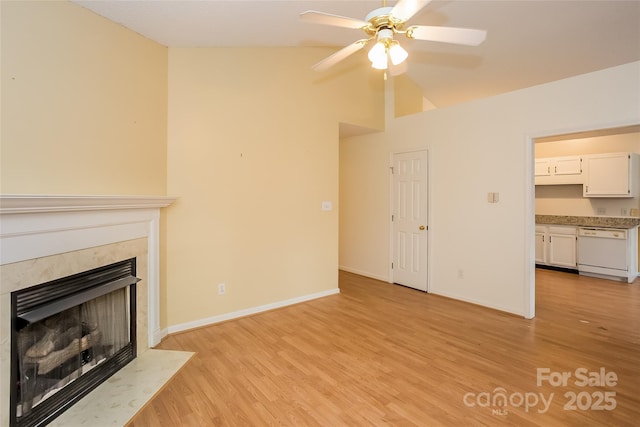 828 Saint Andrews Pl, Concord, NC 28025 - unfurnished living room with a fireplace, light wood-type flooring, ceiling fan, and lofted ceiling