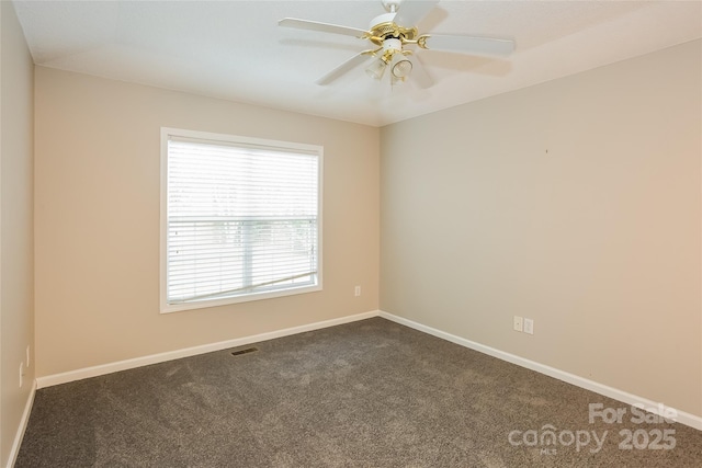 828 Saint Andrews Pl, Concord, NC 28025 - spare room with dark colored carpet and a ceiling fan