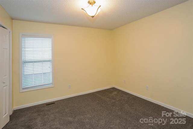 828 Saint Andrews Pl, Concord, NC 28025 - spare room with dark carpet and baseboards