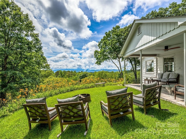 170 Twin Springs Rd, Hendersonville, NC 28792 - view of green lawn featuring an outdoor living space with a fire pit, a ceiling fan, and a patio area