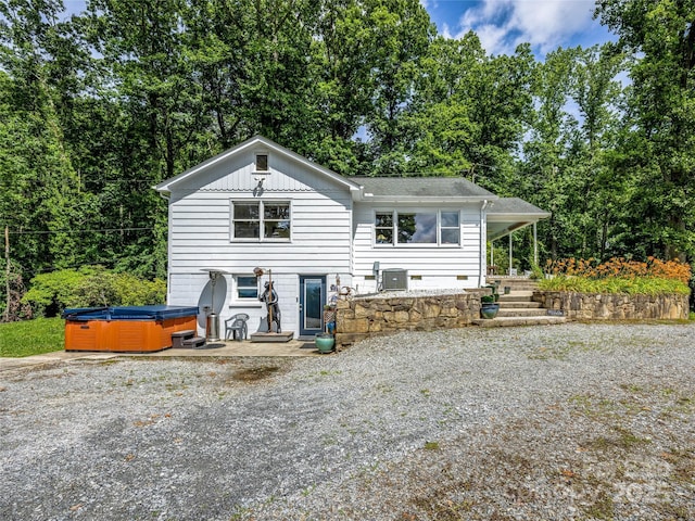 170 Twin Springs Rd, Hendersonville, NC 28792 - rear view of property with a hot tub, driveway, and roof with shingles