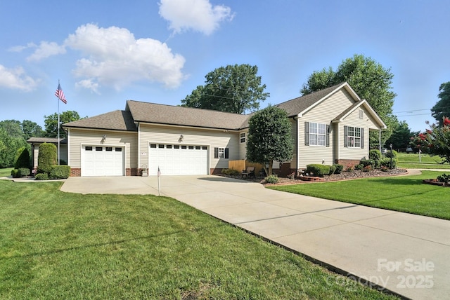 402 Walnut St Unit 11, China Grove, NC 28023 - view of front of home with a garage, concrete driveway, a front yard, and a shingled roof