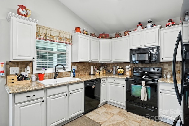 402 Walnut St Unit 11, China Grove, NC 28023 - kitchen with black appliances, lofted ceiling, white cabinets, backsplash, and light stone countertops