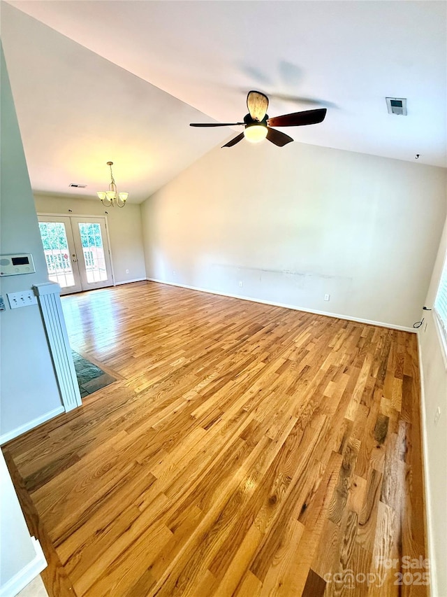4351 Grover Pl, Granite Falls, NC 28630 - unfurnished room with wood finished floors, a chandelier, ceiling fan, french doors, and lofted ceiling