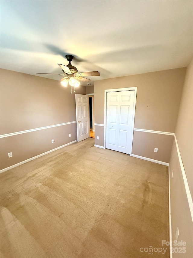 4351 Grover Pl, Granite Falls, NC 28630 - unfurnished bedroom featuring carpet, a ceiling fan, and a closet