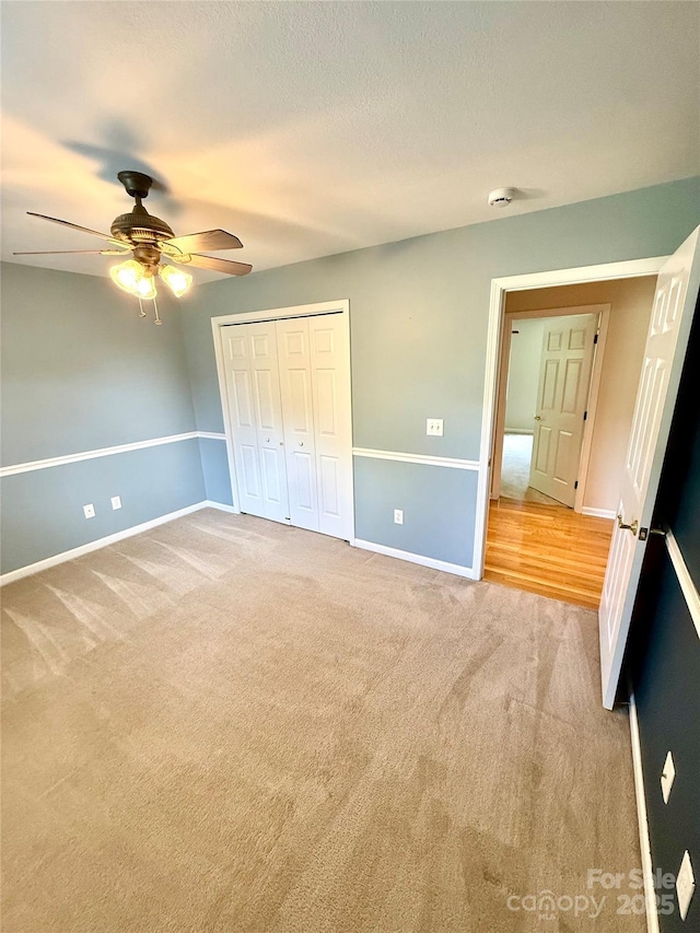 4351 Grover Pl, Granite Falls, NC 28630 - unfurnished bedroom with light carpet, a ceiling fan, and a closet