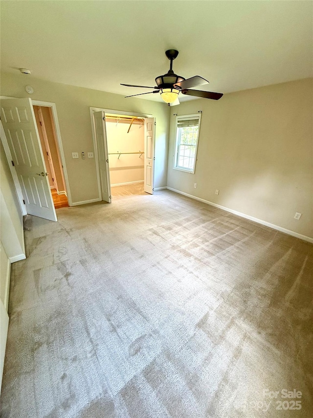 4351 Grover Pl, Granite Falls, NC 28630 - unfurnished bedroom with carpet flooring, a spacious closet, and ceiling fan
