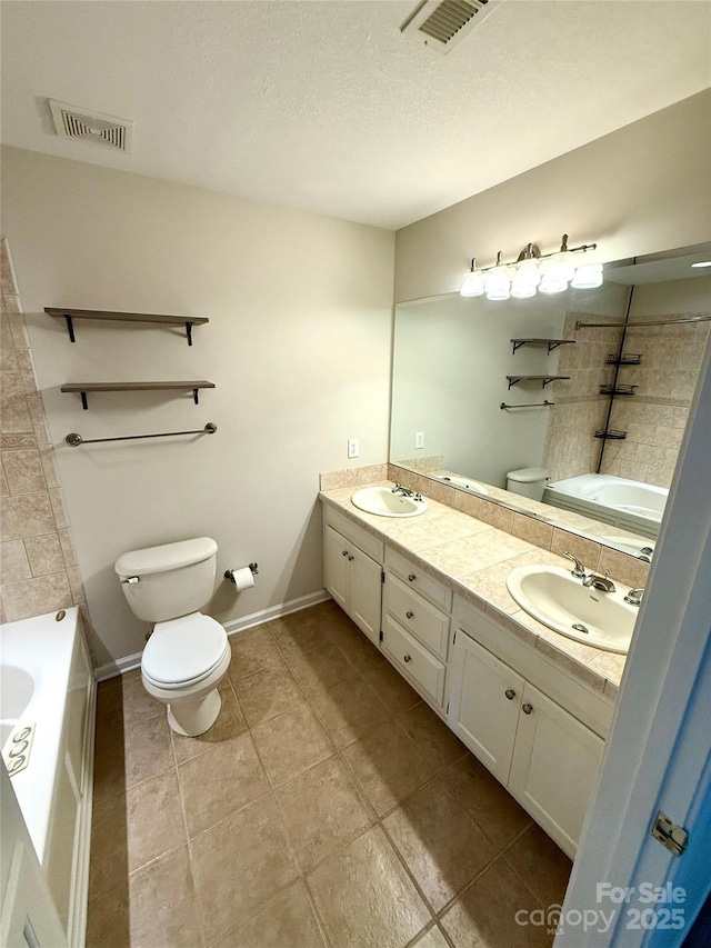 4351 Grover Pl, Granite Falls, NC 28630 - full bathroom featuring double vanity, tile patterned flooring, a textured ceiling, and  shower combination