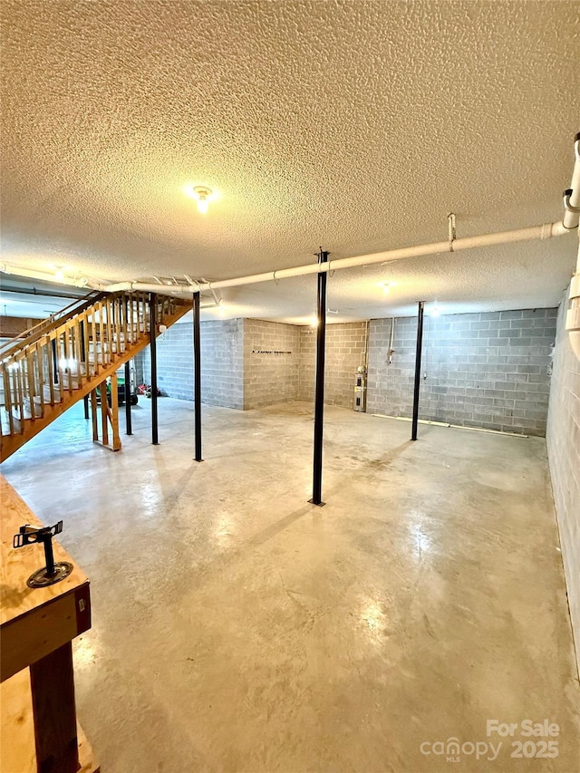 4351 Grover Pl, Granite Falls, NC 28630 - unfinished basement featuring a textured ceiling and concrete block wall