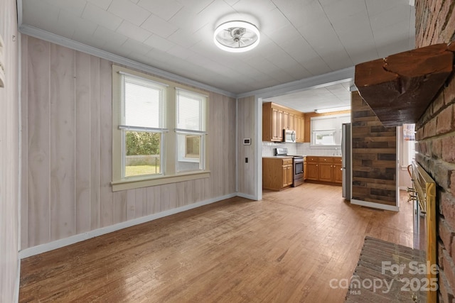 435 Stirewalt Rd, China Grove, NC 28023 - unfurnished living room with light wood-style floors, ornamental molding, a fireplace, and wooden walls