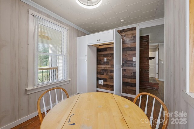 435 Stirewalt Rd, China Grove, NC 28023 - dining space featuring ornamental molding and wood walls